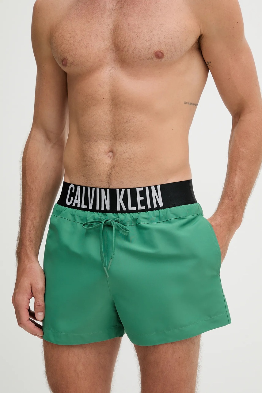 Levně Plavkové šortky Calvin Klein zelená barva, LV00N61094