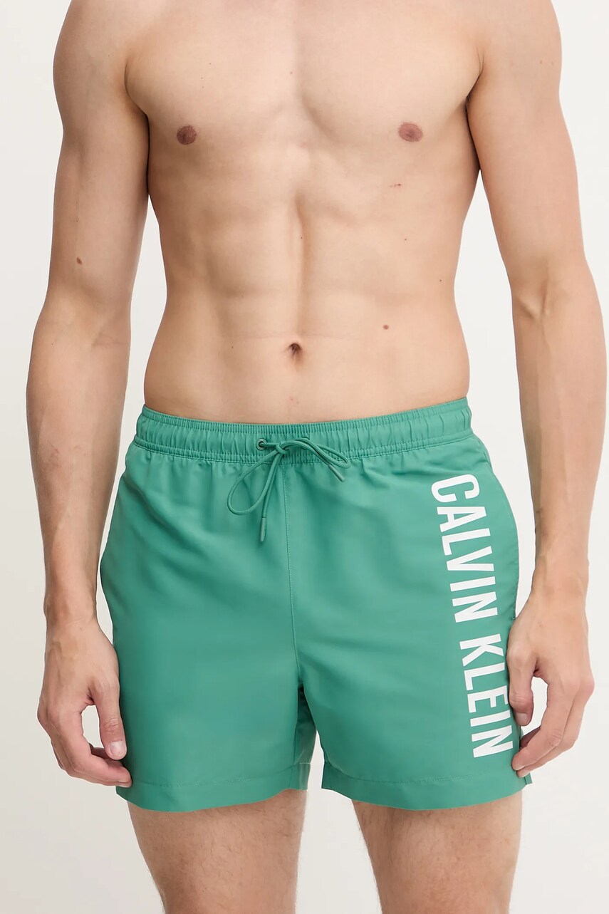 Levně Plavkové šortky Calvin Klein zelená barva, LV00N61092