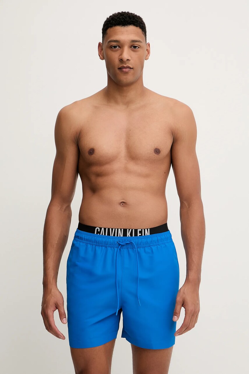 Levně Plavkové šortky Calvin Klein modrá barva, LV00N61093