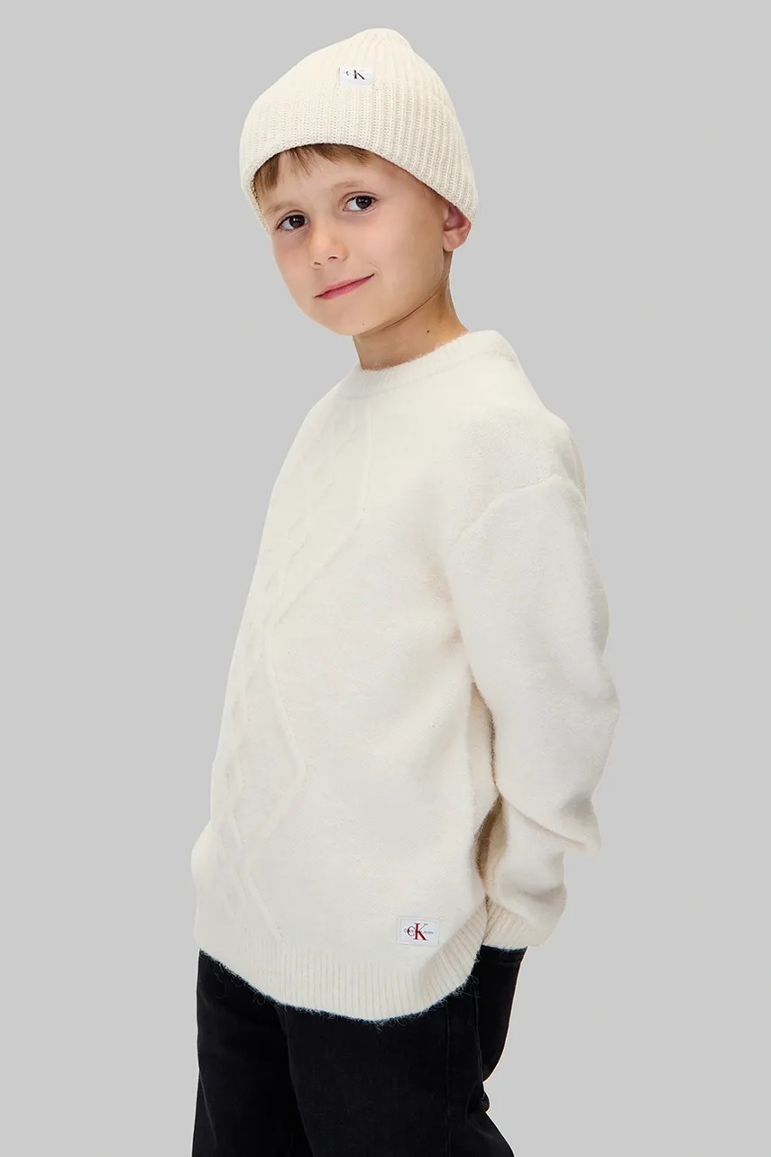 Levně Dětská mikina Calvin Klein Jeans béžová barva, hladká, IB0IB02586