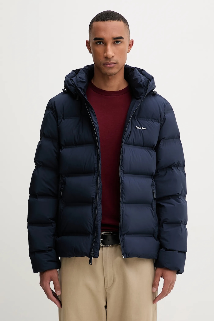 Levně Péřová bunda Calvin Klein tmavomodrá barva, zimní, LV04LD517G