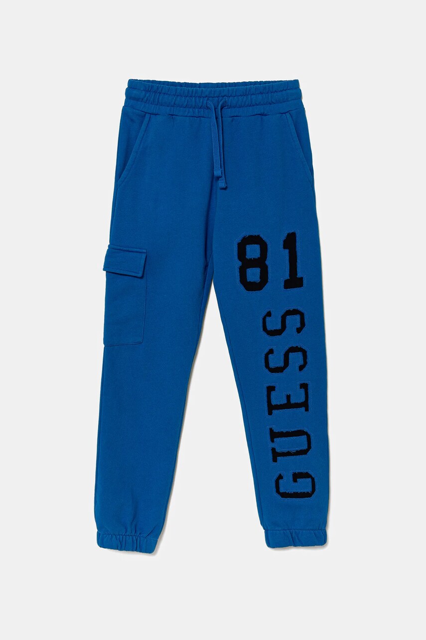 Levně Dětské bavlněné tepláky Guess modrá barva, s potiskem, L5YQ13 KAD74