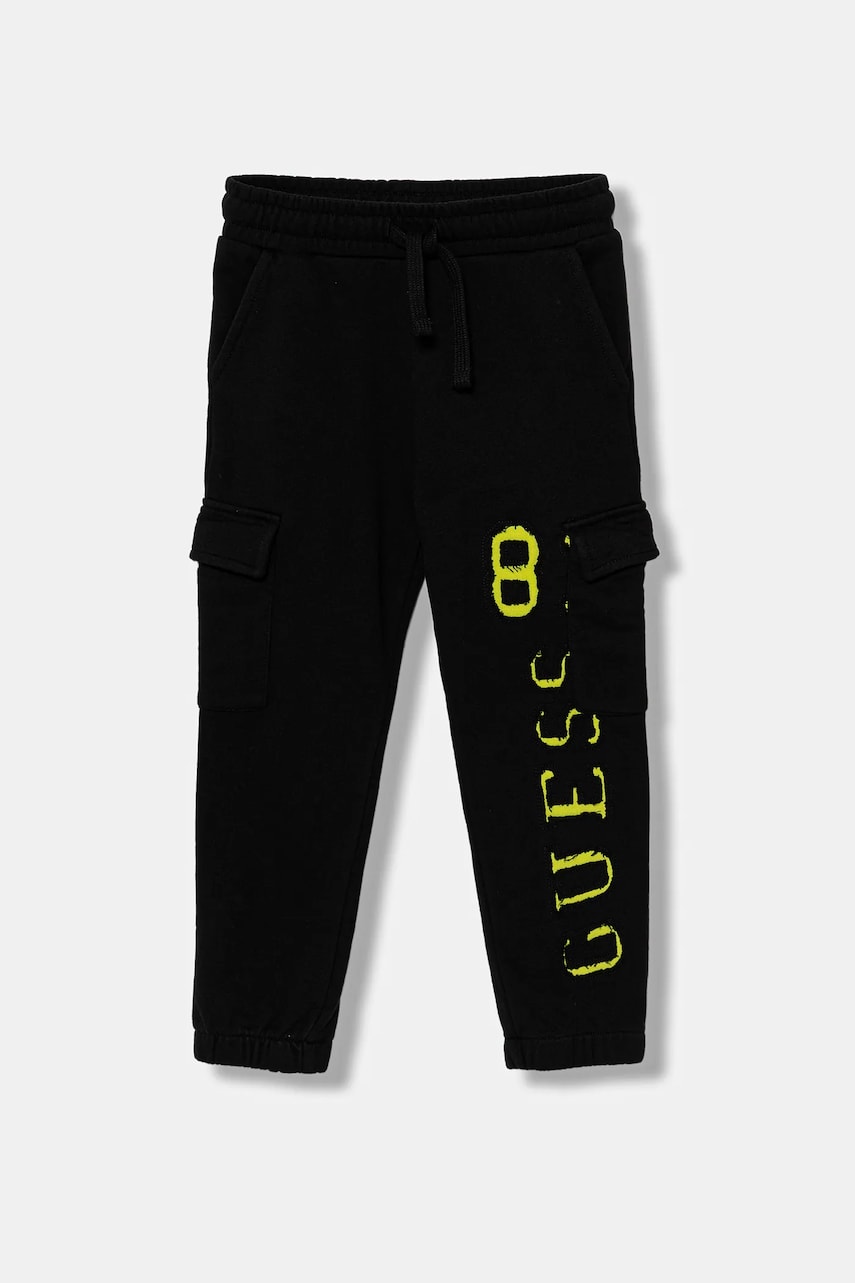 Levně Dětské tepláky Guess černá barva, s aplikací, N5YQ13 KAD74
