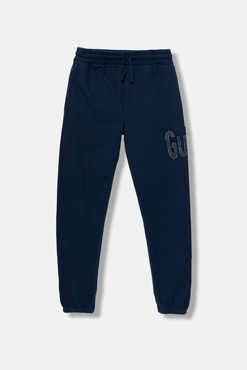Levně Dětské bavlněné tepláky Guess tmavomodrá barva, s aplikací, L5BQ16 KAD74