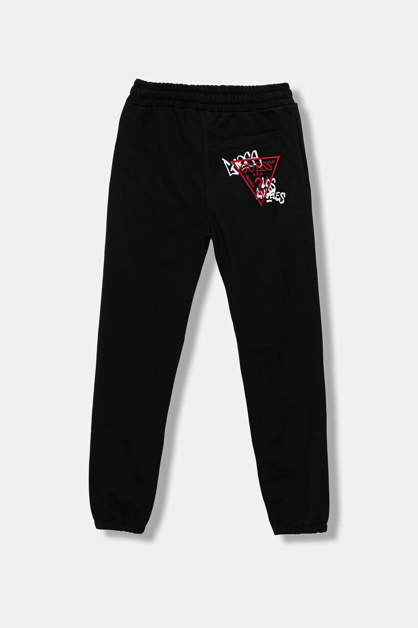 Levně Dětské bavlněné tepláky Guess černá barva, s aplikací, L5BQ16 KAD74