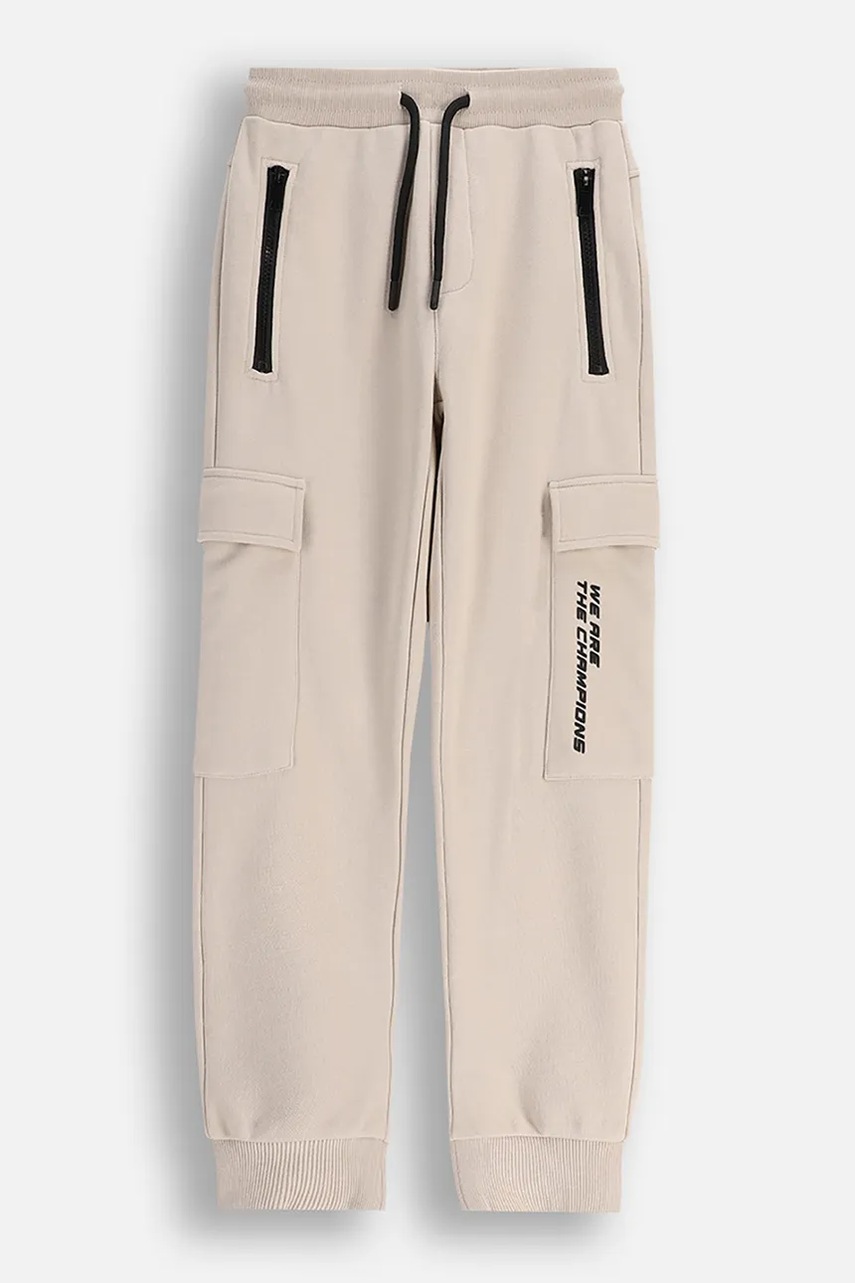 Coccodrillo pantaloni de bumbac pentru copii culoarea bej, uni, CITY RACING BOY JUNIOR