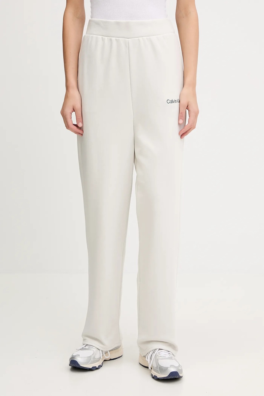 Levně Tepláky Calvin Klein Performance dámské, béžová barva, LVGWF5P627