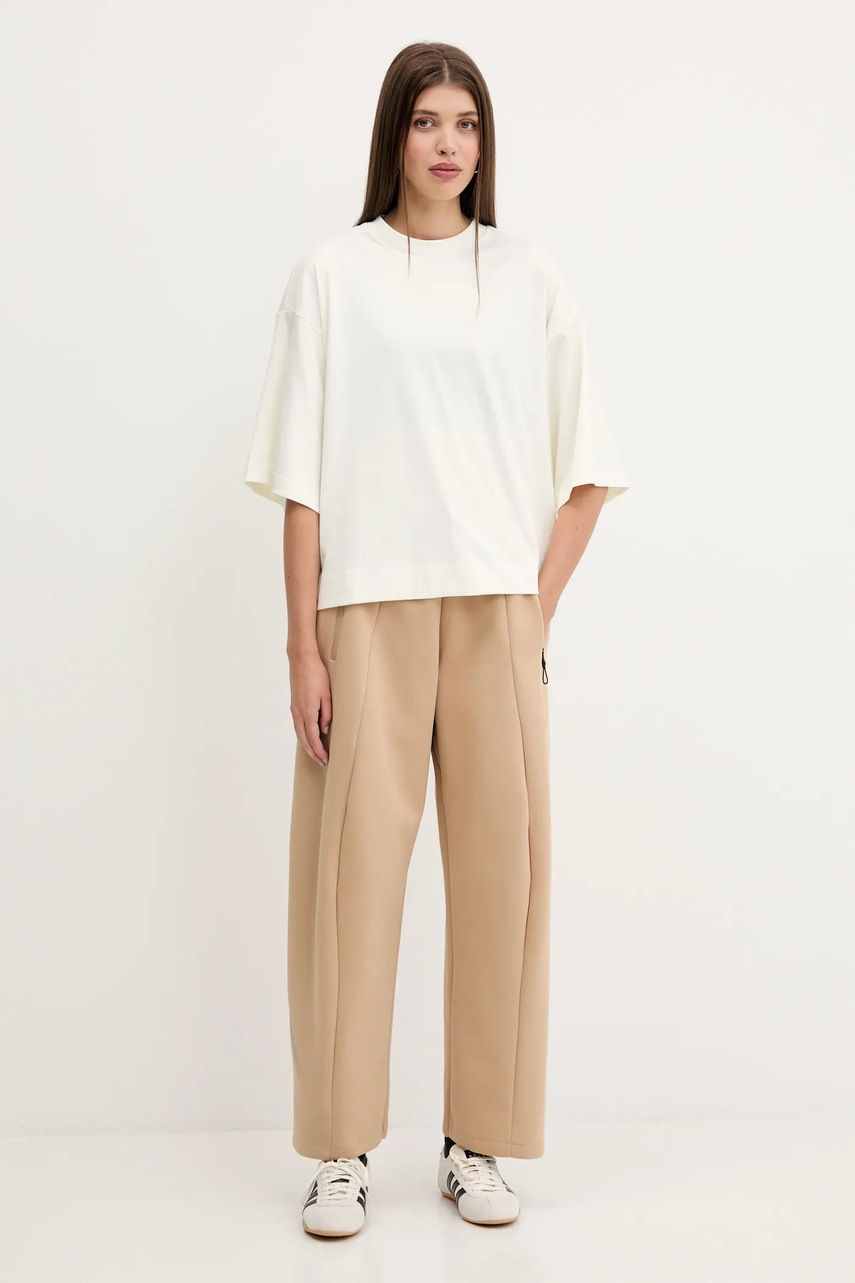 Спортивные штаны adidas Z.N.E. цвет бежевый однотонные JW7770