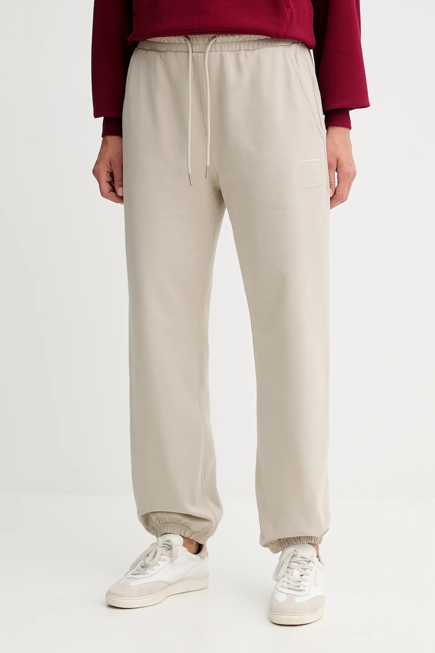 Levně Tepláky Calvin Klein dámské, béžová barva, s aplikací, LV044D205G