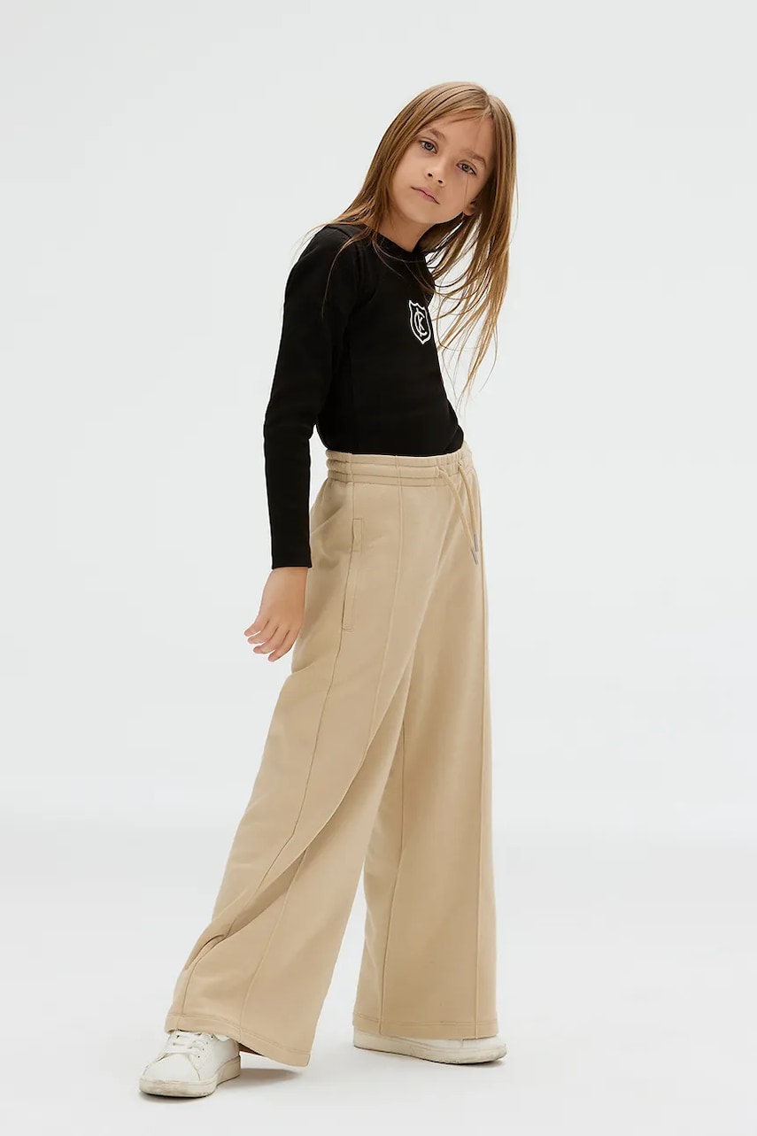 Levně Dětské tepláky Calvin Klein Jeans béžová barva, s potiskem, IG0IG02875