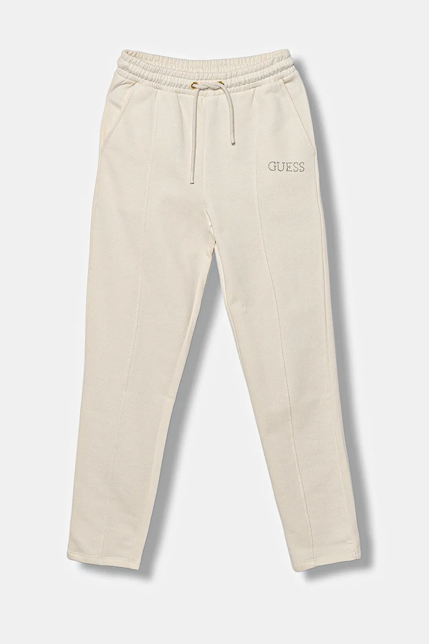 Levně Dětské bavlněné tepláky Guess béžová barva, s aplikací, J5YQ17 KAV34