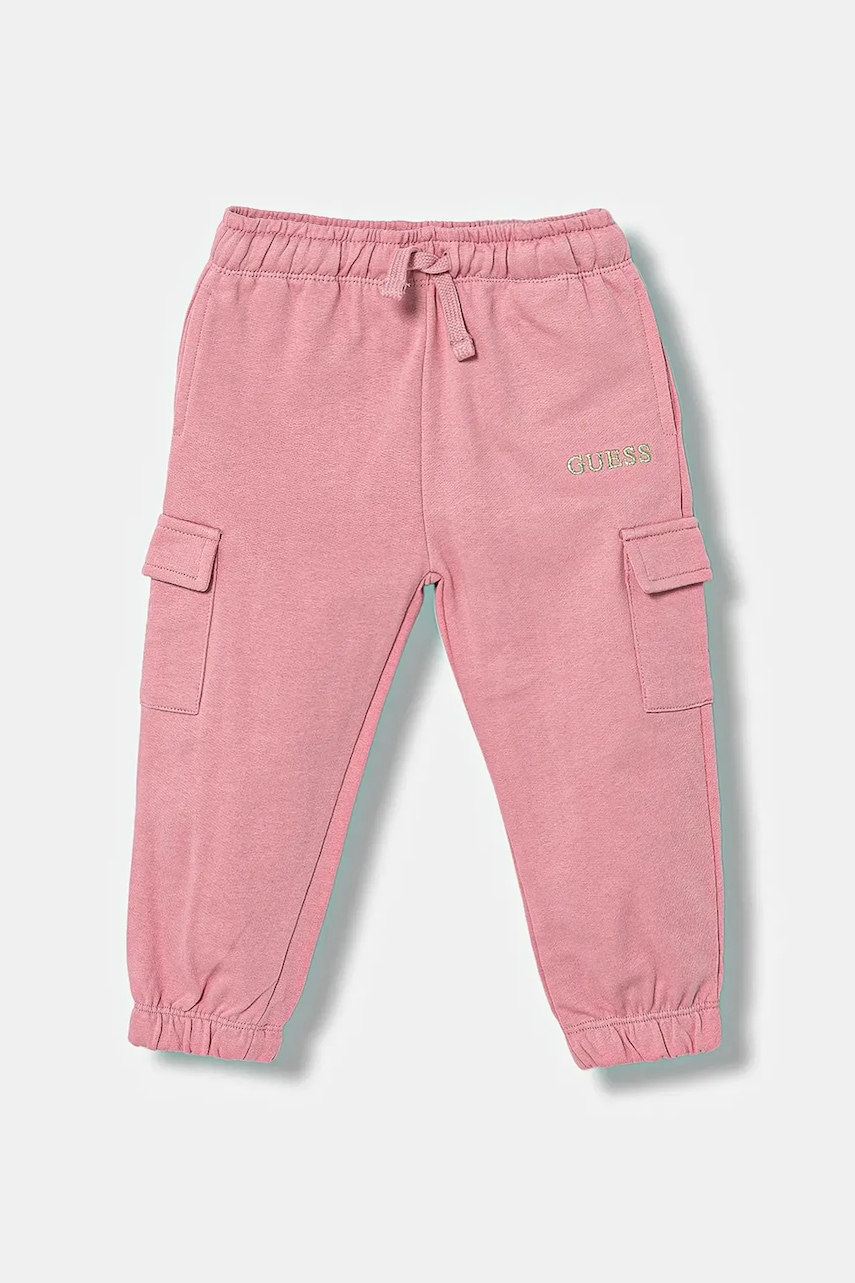 Levně Dětské bavlněné tepláky Guess růžová barva, s aplikací, K5YQ16 KA6R4
