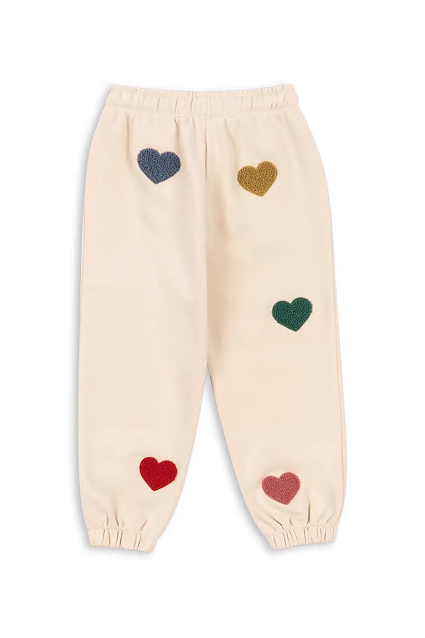 Детские спортивные штаны Konges Sløjd LOU TERRY SWEAT PANTS OCS цвет бежевый с аппликацией KS103870 Детские спортивные штаны Konges Sløjd LOU TERRY SWEAT PANTS OCS цвет бежевый с аппликацией KS103870