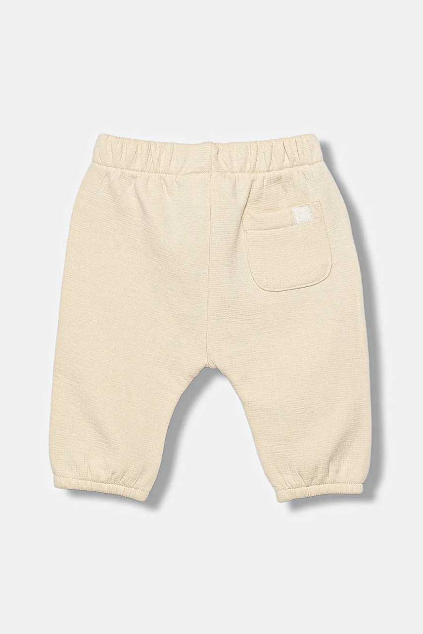 Детские спортивные штаны United Colors of Benetton цвет бежевый однотонные 3ITEAF02E