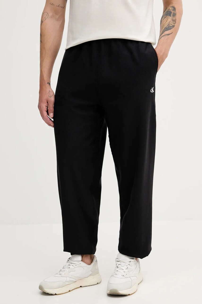 Levně Tepláky Calvin Klein Jeans pánské, černá barva, LV04RC279G