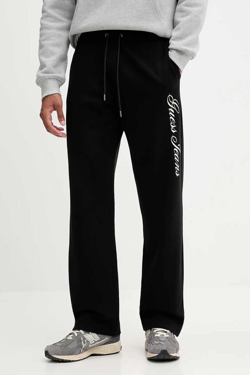Levně Bavlněné tepláky Guess Jeans pánské, černá barva, M5YB66 KCPR1