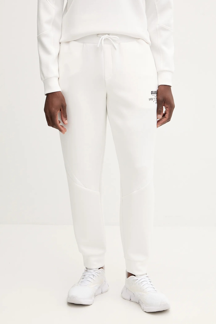 Levně Tepláky Guess RYOTA pánské, bílá barva, s potiskem, Z5BB00 KCNS2