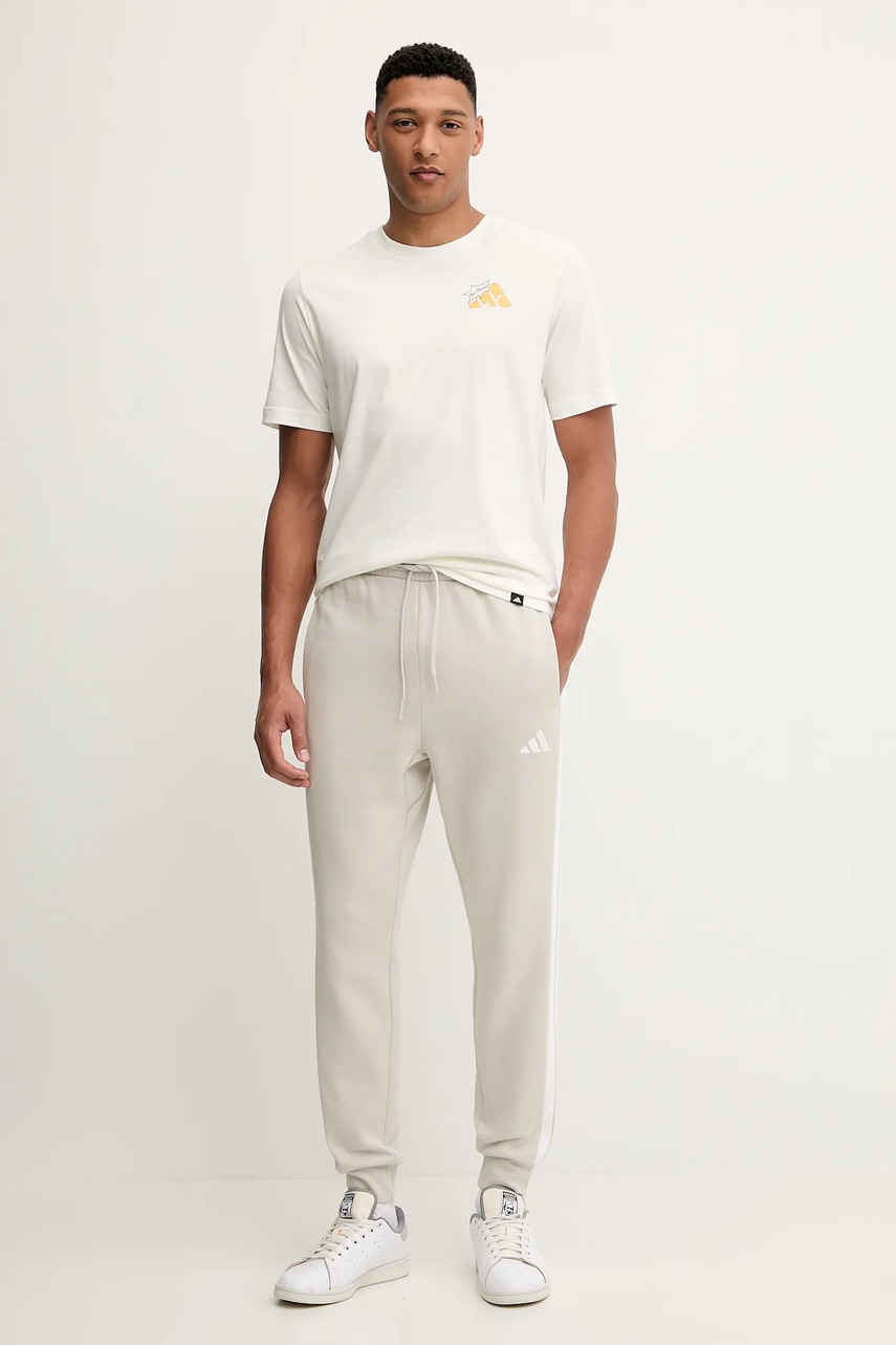 Спортивные штаны adidas Essentials цвет бежевый с аппликацией JE6317