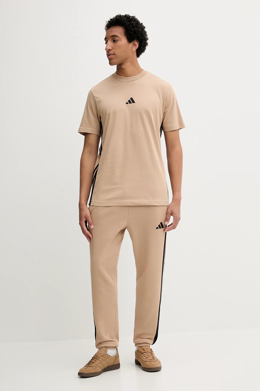 Спортивные штаны adidas Essentials цвет бежевый с аппликацией JX0712