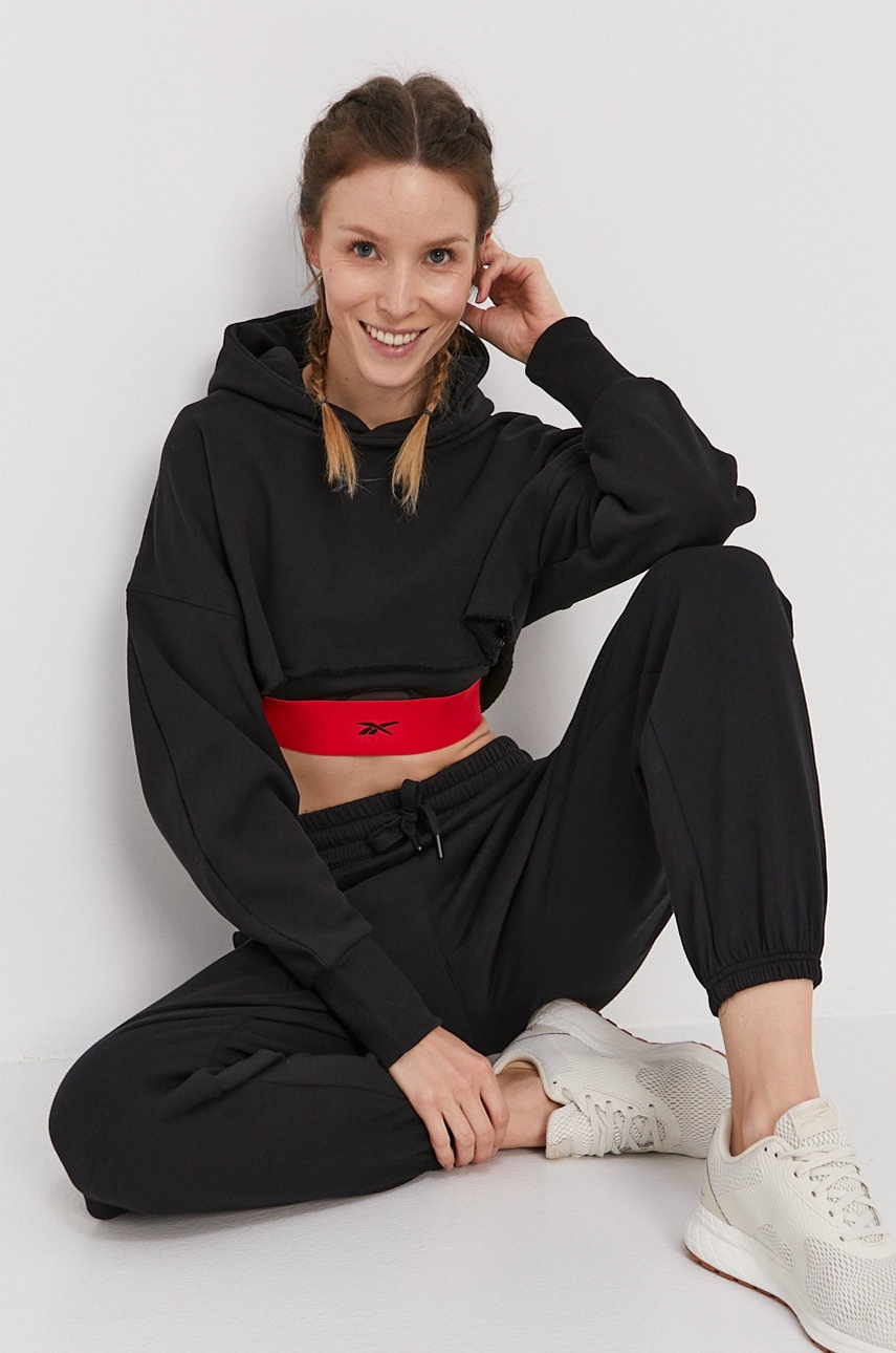 

Штани Reebok жіночі колір чорний гладкі