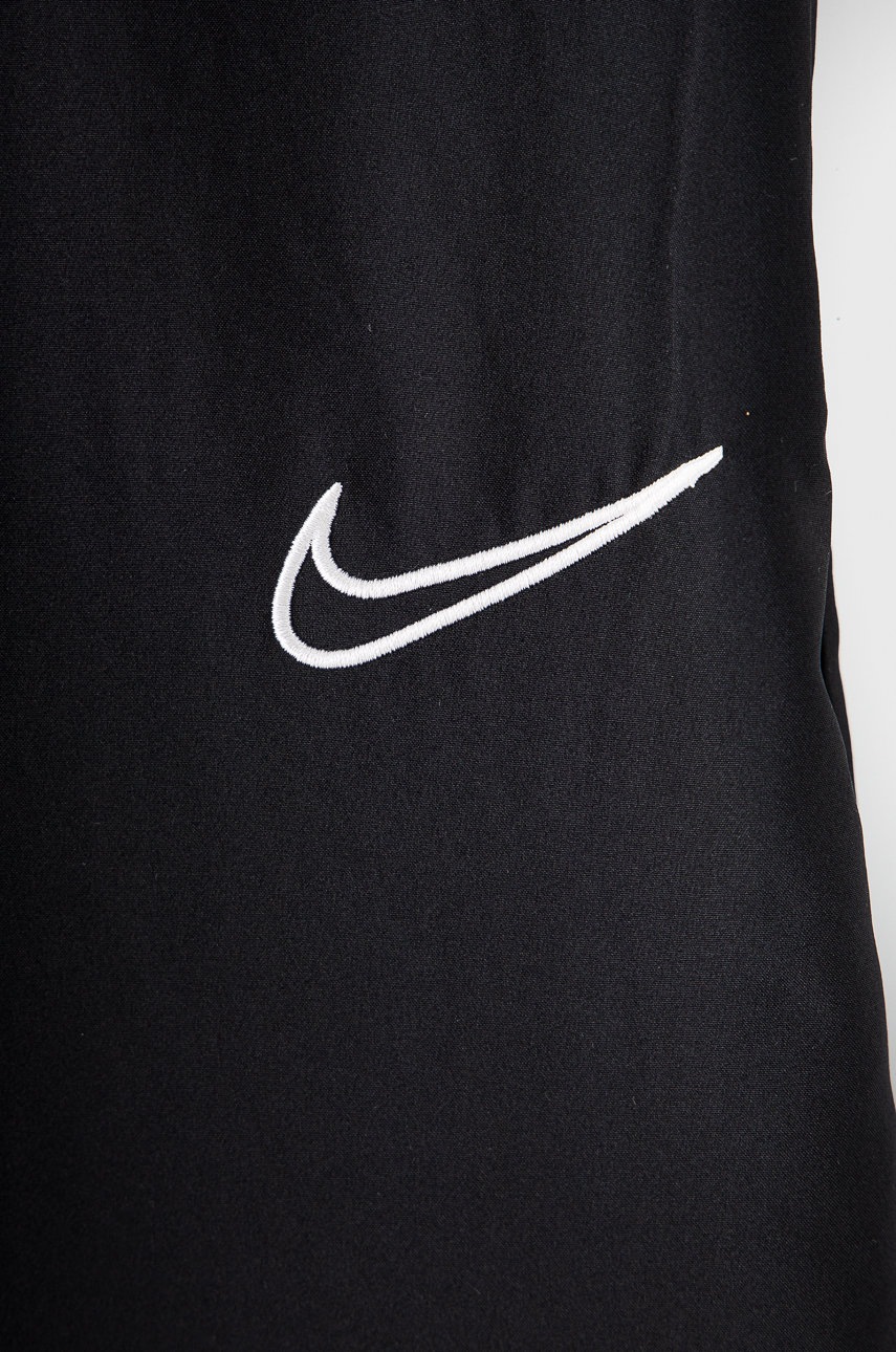 

Детские брюки Nike Kids цвет чёрный гладкие