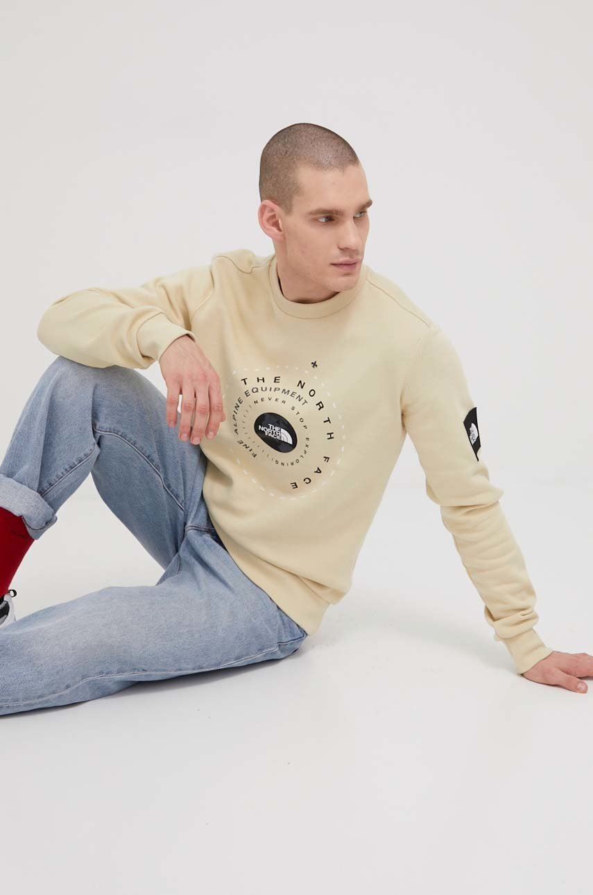 

Бавовняна кофта The North Face чоловіча колір бежевий з принтом