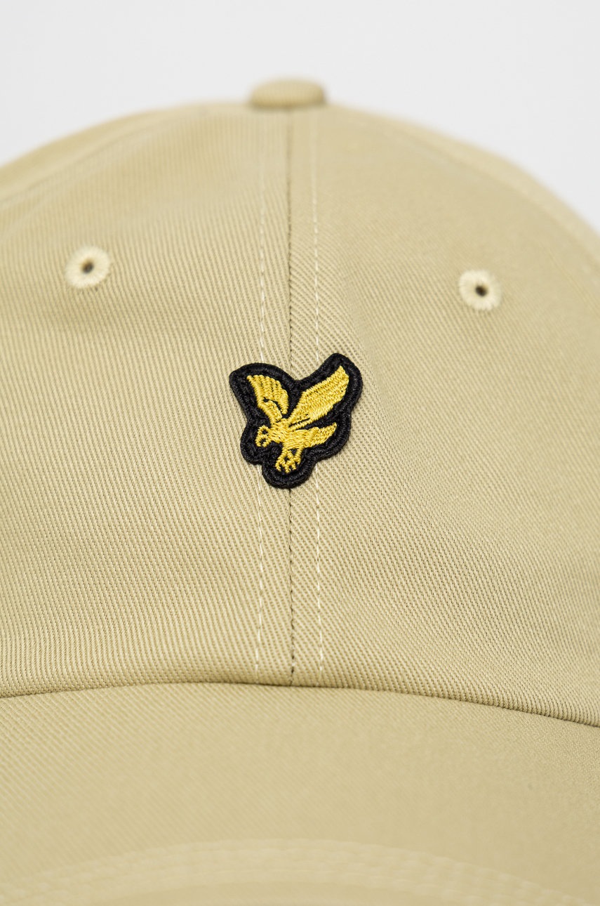 

Бавовняна шапка Lyle & Scott колір бежевий однотонна