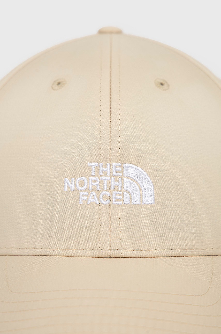 

Кепка The North Face колір бежевий з аплікацією