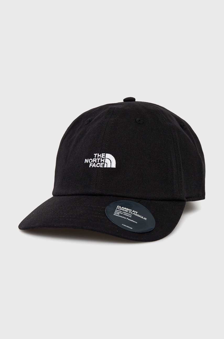 

Памучна шапка The North Face в черно с апликация, Черен