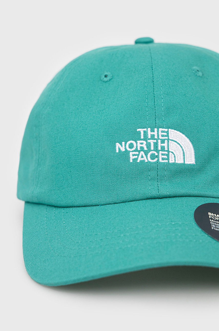 

Бавовняна кепка The North Face колір зелений з аплікацією