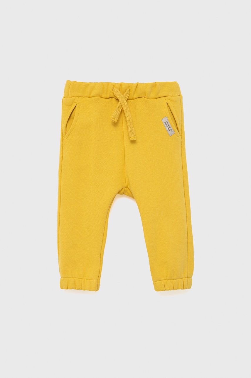 

Детские хлопковые брюки United Colors of Benetton цвет жёлтый однотонные