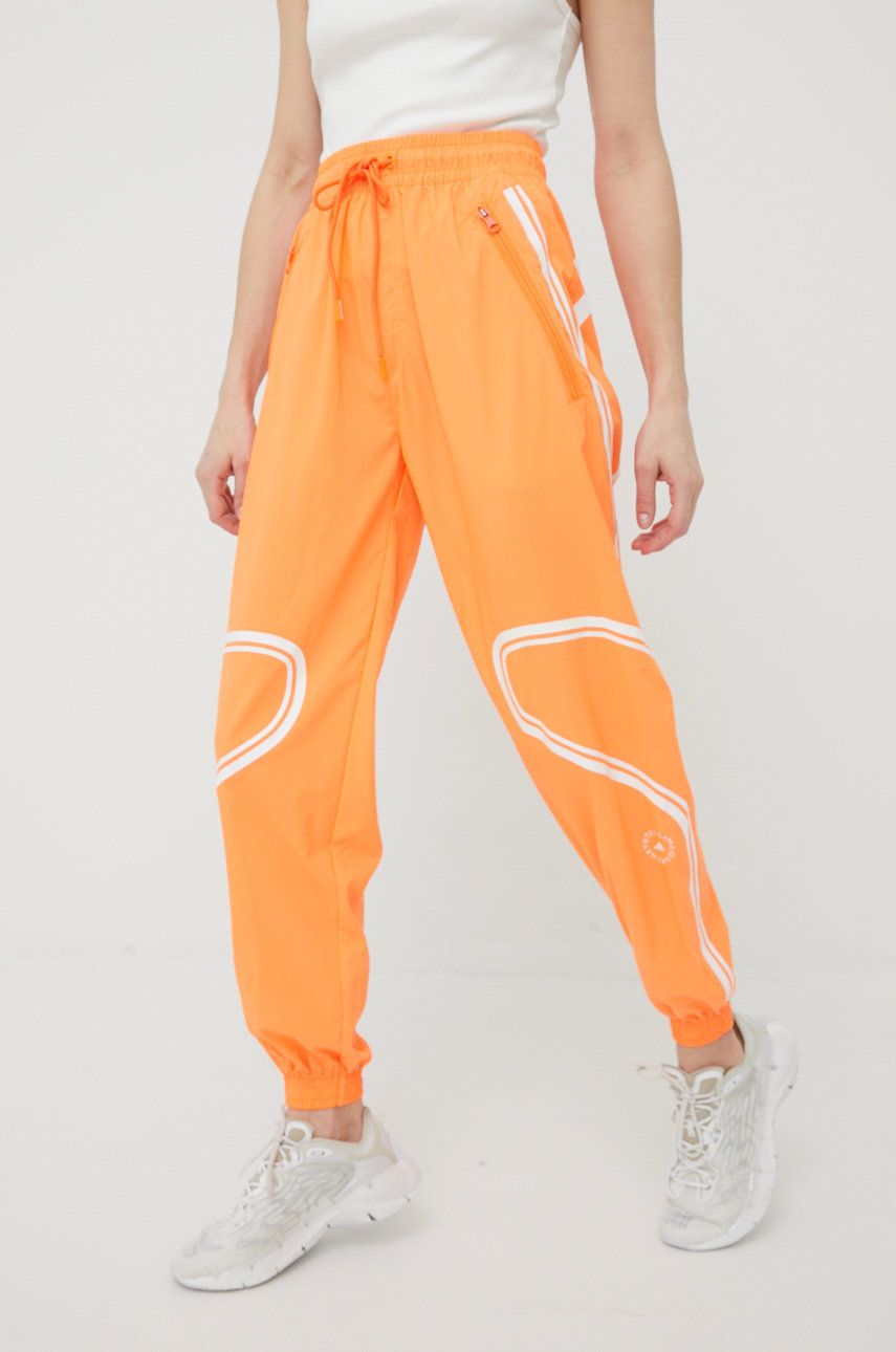 Adidas by Stella McCartney spodnie treningowe Truepace HC2985 damskie kolor pomarańczowy z nadrukiem