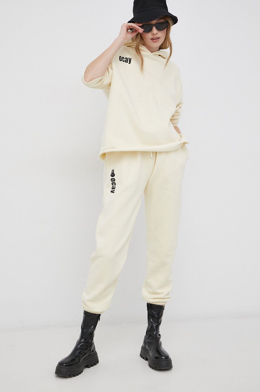 Bavlněné kalhoty OCAY dámské, žlutá barva, s potiskem - béžová -  100% Organická bavlna