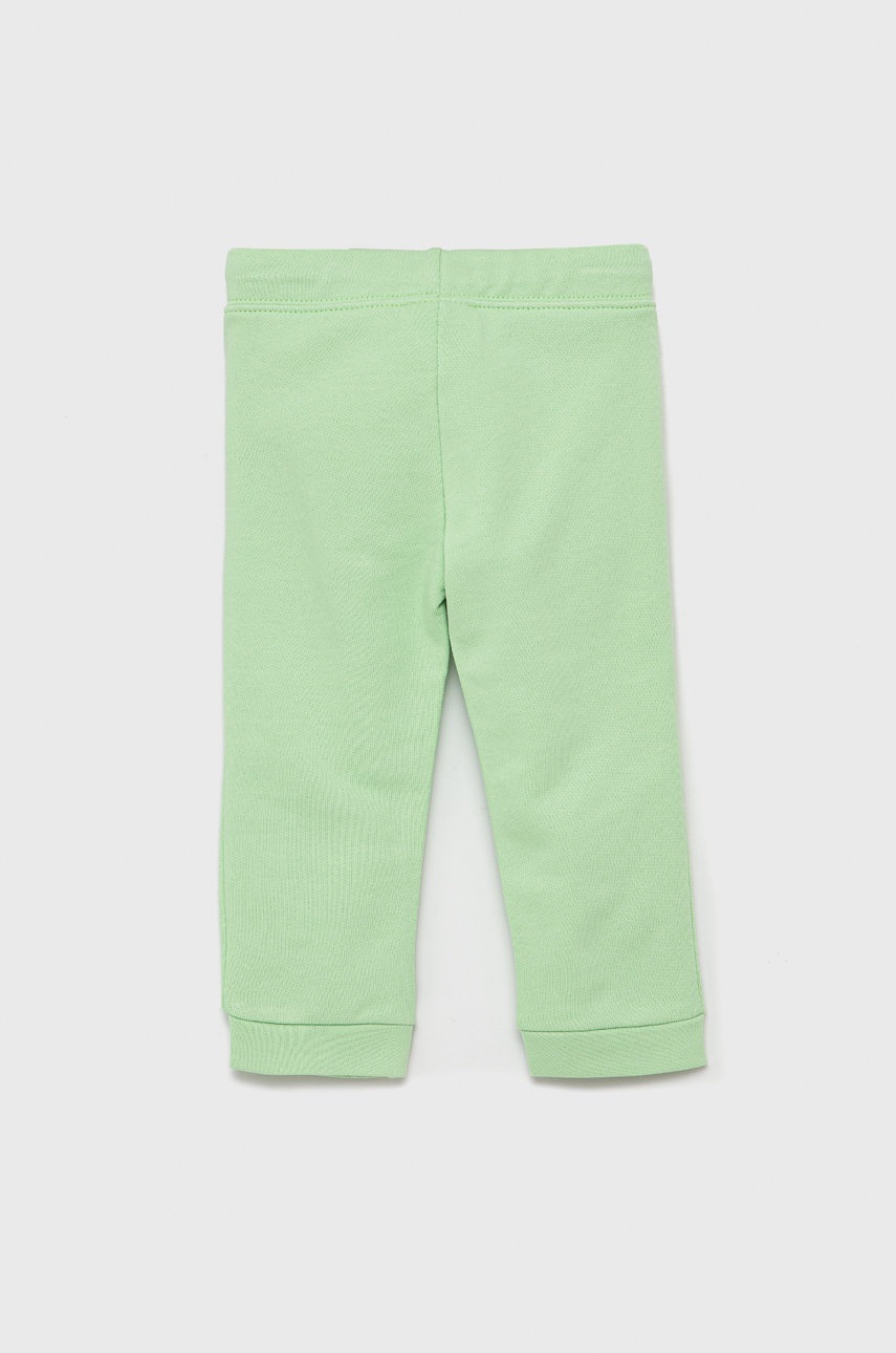 

Дитячі бавовняні штани United Colors of Benetton колір зелений гладке