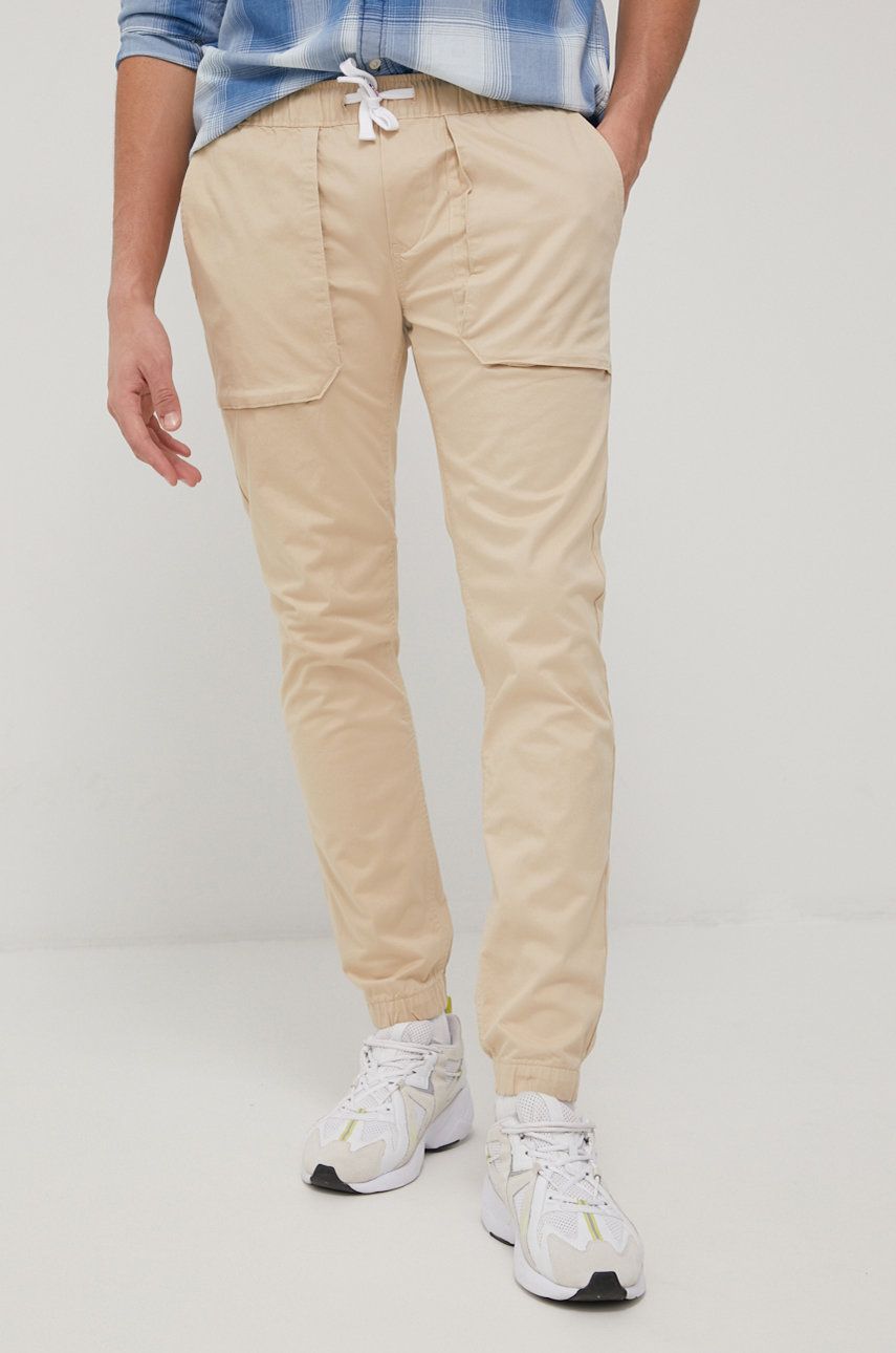 Tommy Jeans spodnie SCANTON męskie kolor beżowy joggery