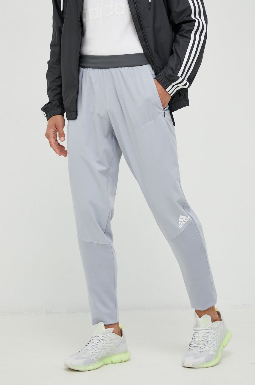 Levně Tréninkové kalhoty adidas Performance pánské, šedá barva, s potiskem