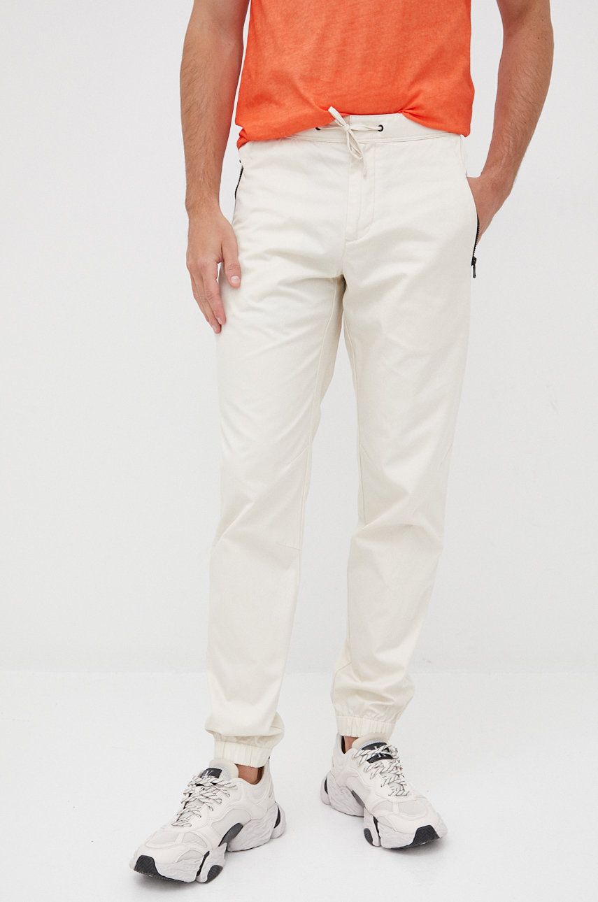 Levně Bavlněné kalhoty Sisley pánské, béžová barva, jogger