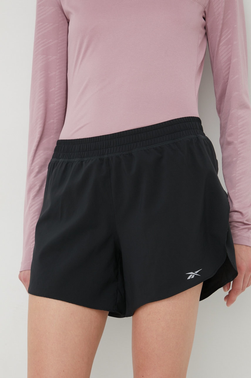 Levně Běžecké šortky Reebok HA1043 černá barva, medium waist