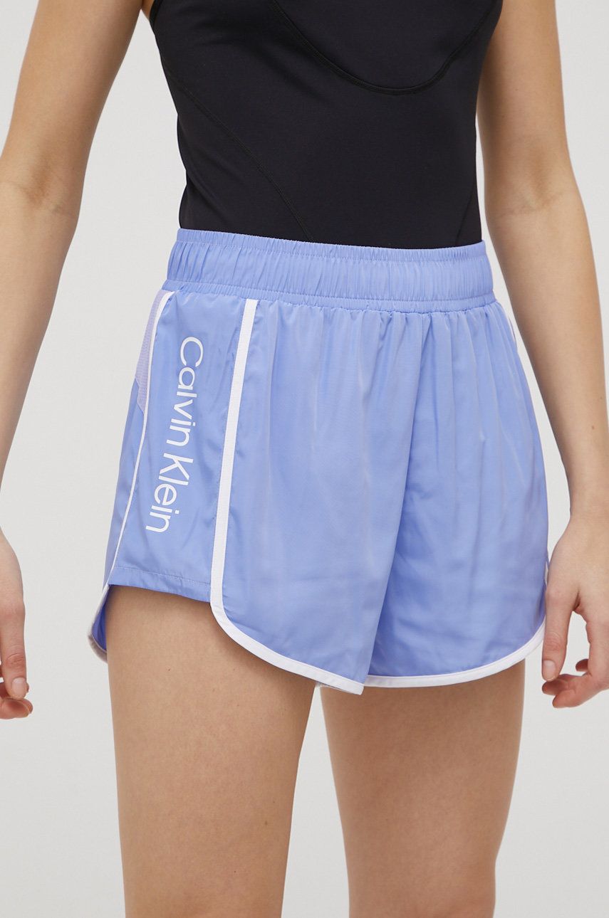 Levně Tréninkové šortky Calvin Klein Performance Ck Essentials dámské, fialová barva, s potiskem, high waist