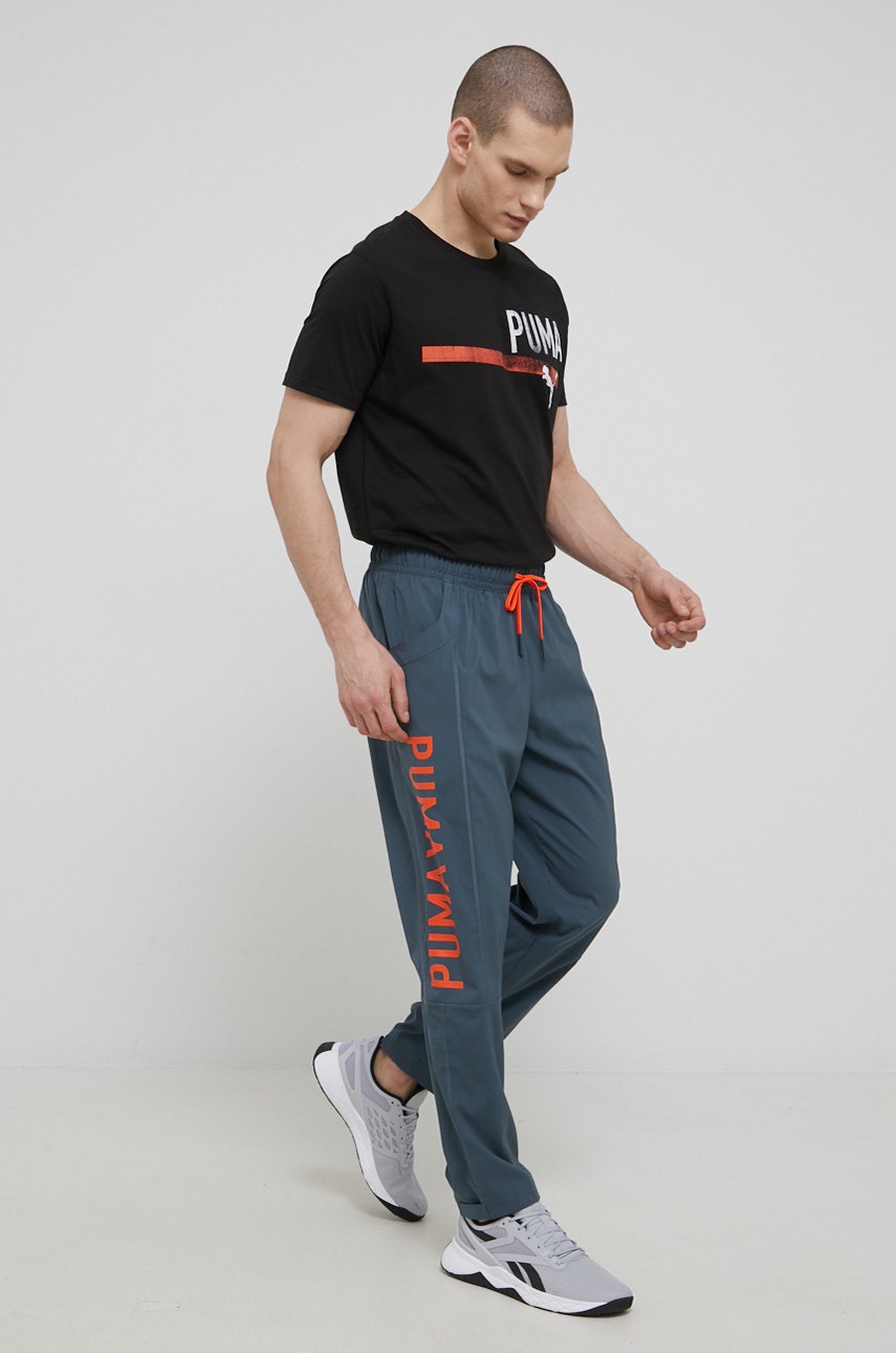 

Тренувальна футболка Puma Perormance Graphic Branded 521641 колір чорний з принтом