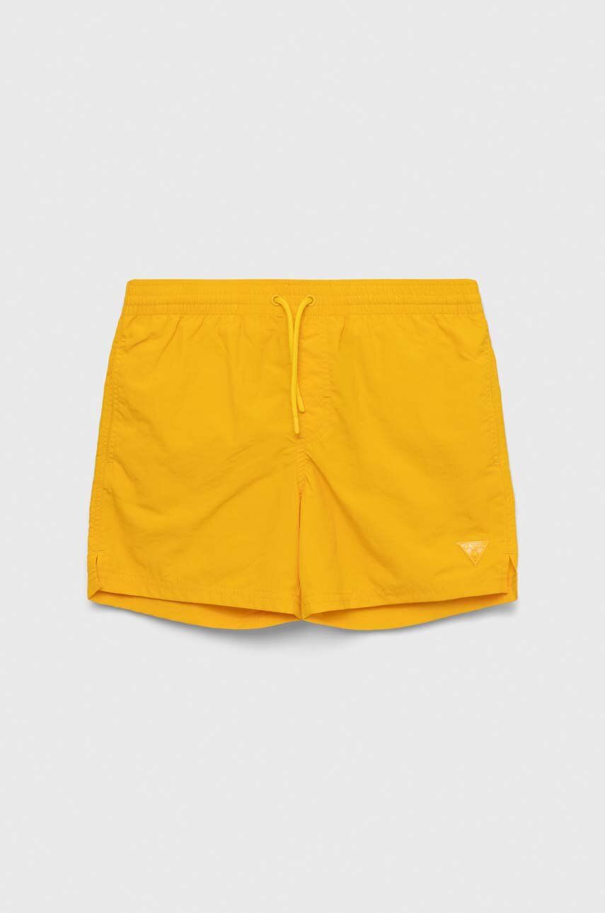 Levně Dětské plavkové šortky Guess žlutá barva