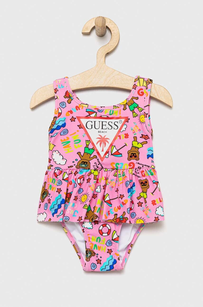 

Суцільний дитячий купальник Guess колір рожевий