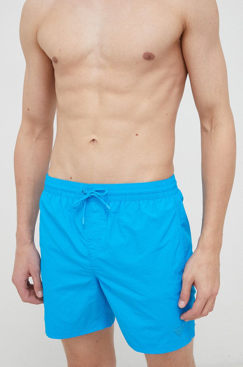 Plavkové šortky Guess - modrá -  Hlavní materiál: 100 % Polyamid Podšívka: 95 % Polyester