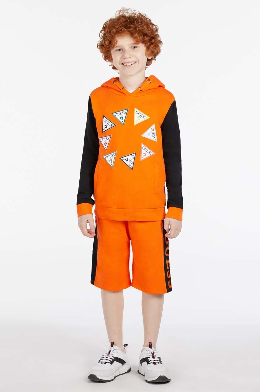 Dětská bavlněná mikina Guess oranžová barva, s kapucí, vzorovaná - oranžová -  100 % Bavlna