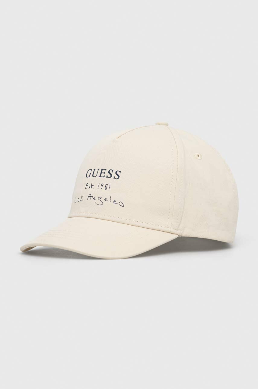 

Хлопковая кепка Guess цвет бежевый с принтом