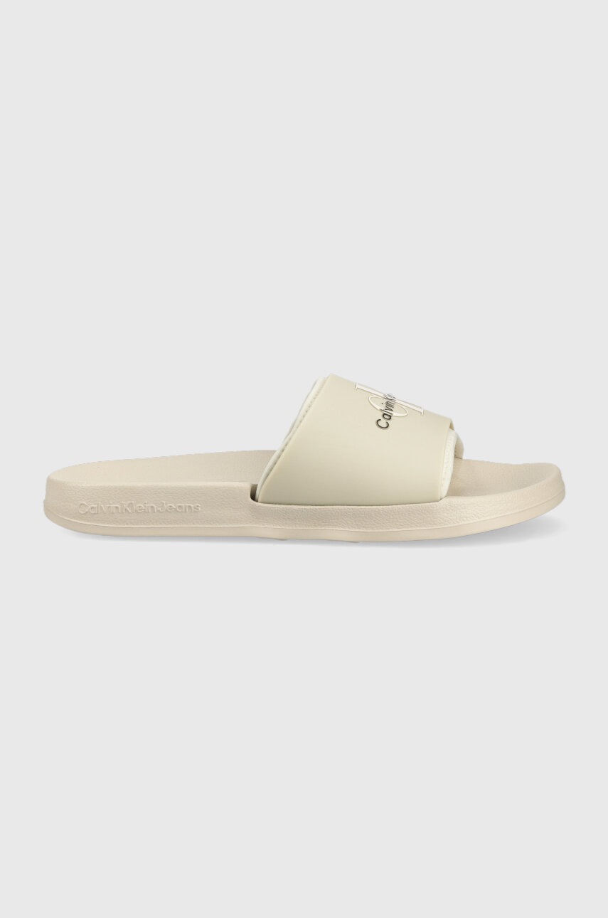 

Чехли Calvin Klein Jeans SLIDE MONOGRAM TPU в бежово YM0YM00361, Бежов