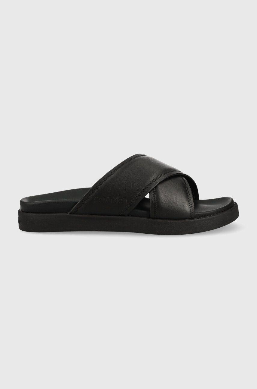 Levně Kožené pantofle Calvin Klein CRISS CROSS SANDAL LTH pánské, černá barva, HM0HM01069