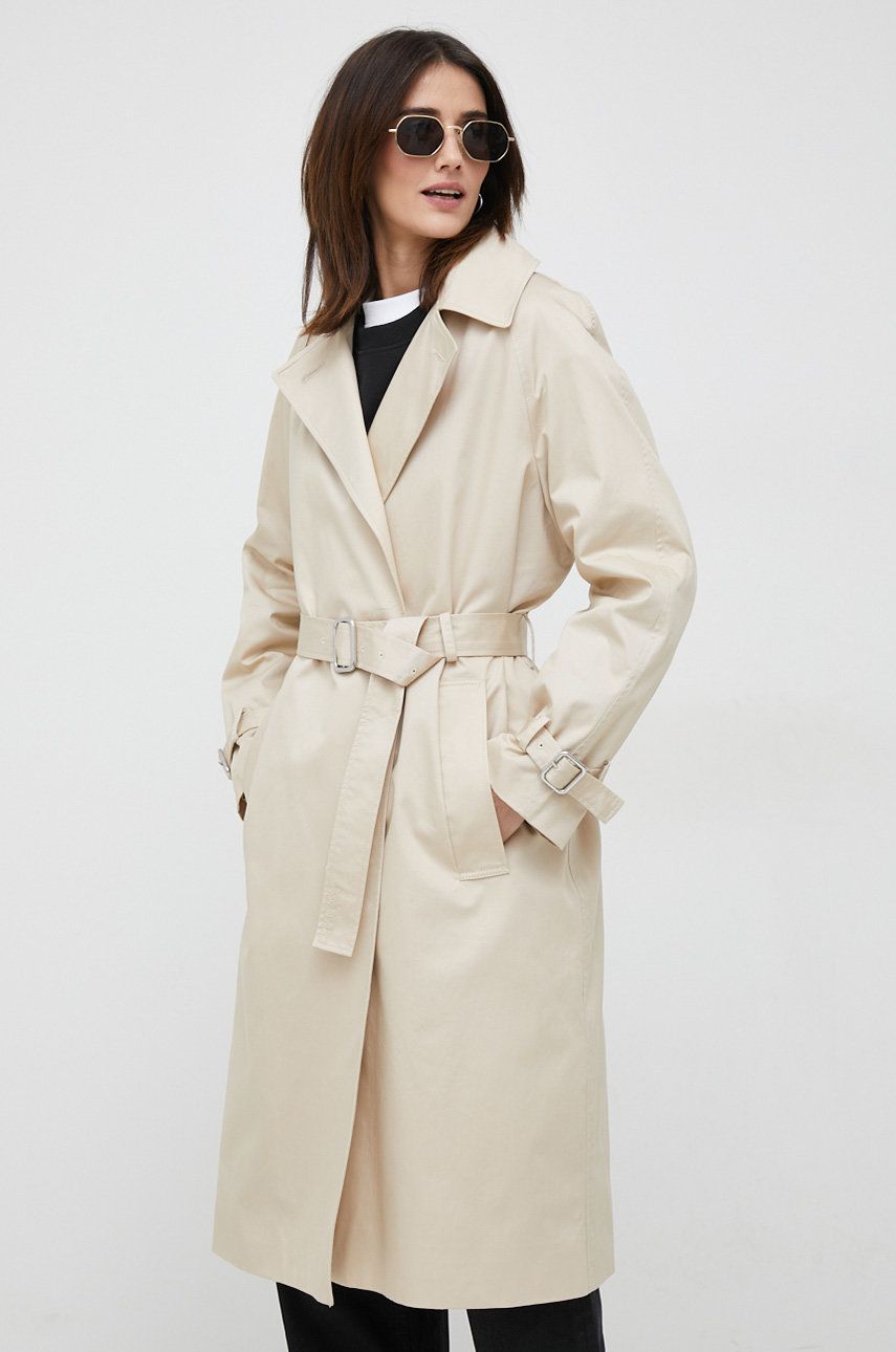 Bavlněný kabát Calvin Klein béžová barva - béžová -  Hlavní materiál: 100 % Bavlna Podšívk