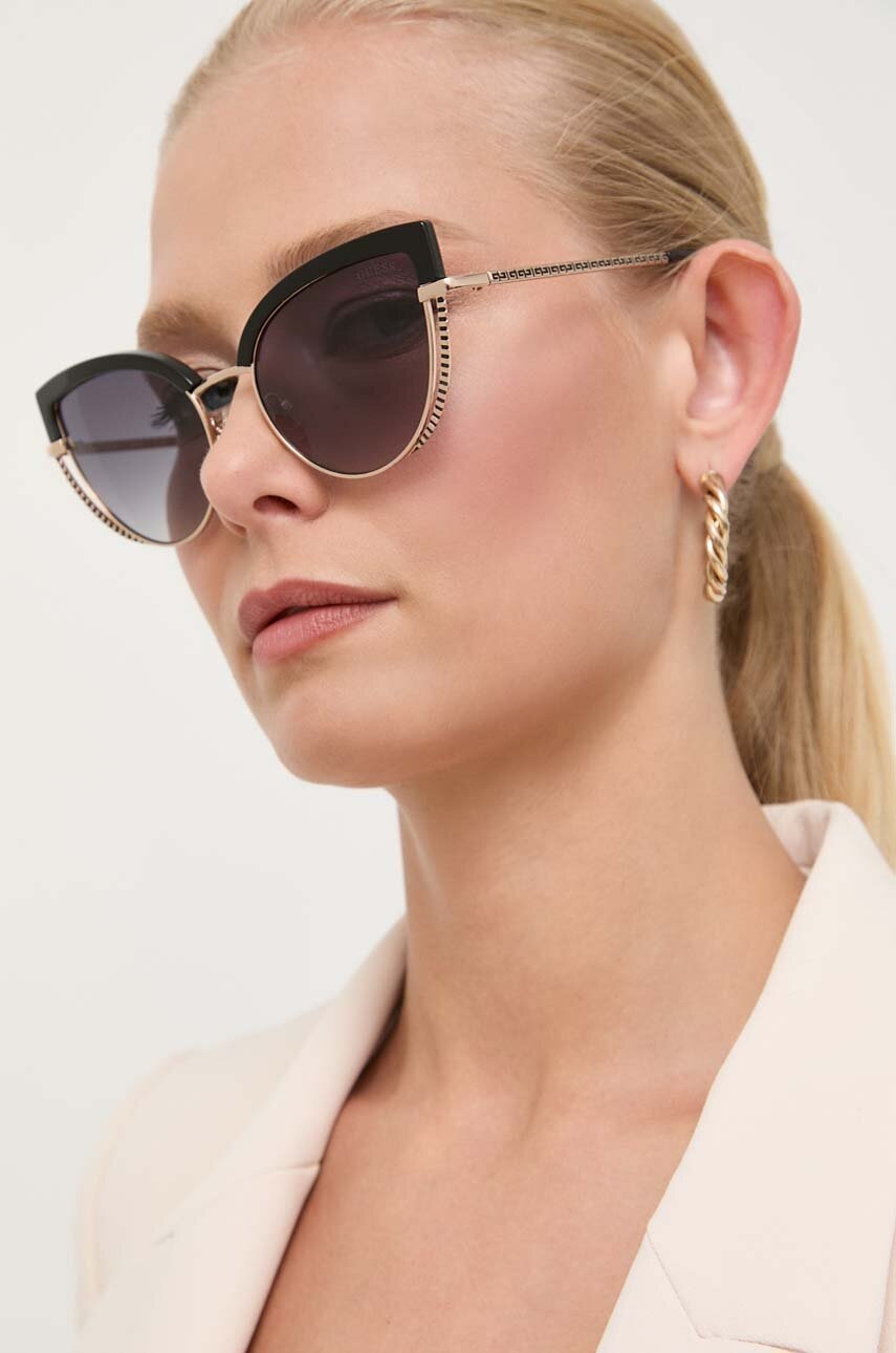 

Солнцезащитные очки Guess женские цвет золотой