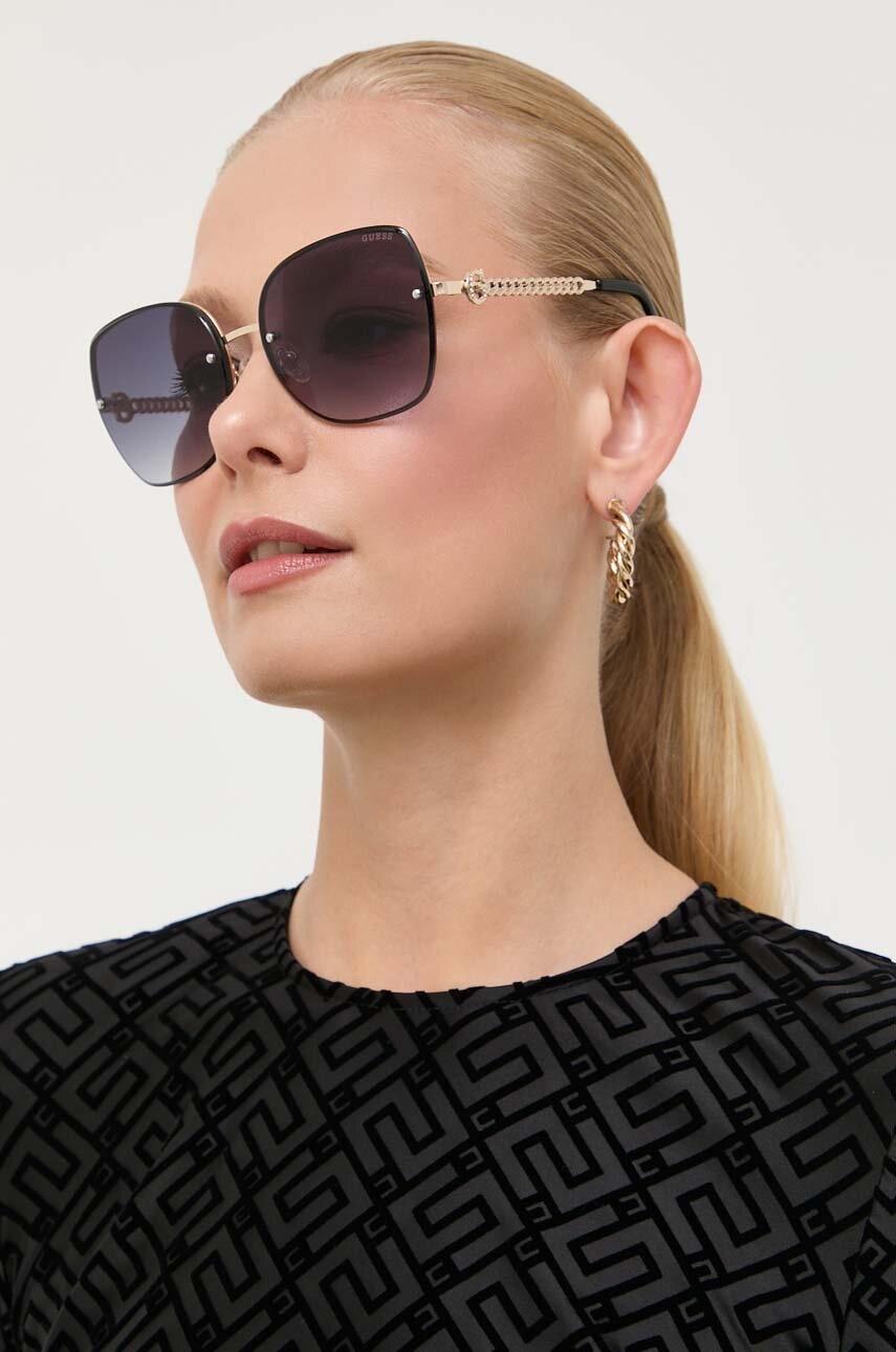

Солнцезащитные очки Guess женские цвет золотой